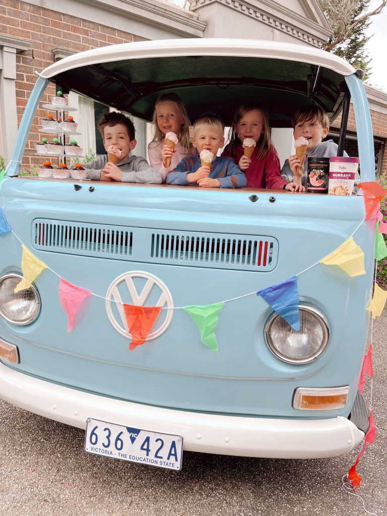 children's party with kids enjoying ice cream