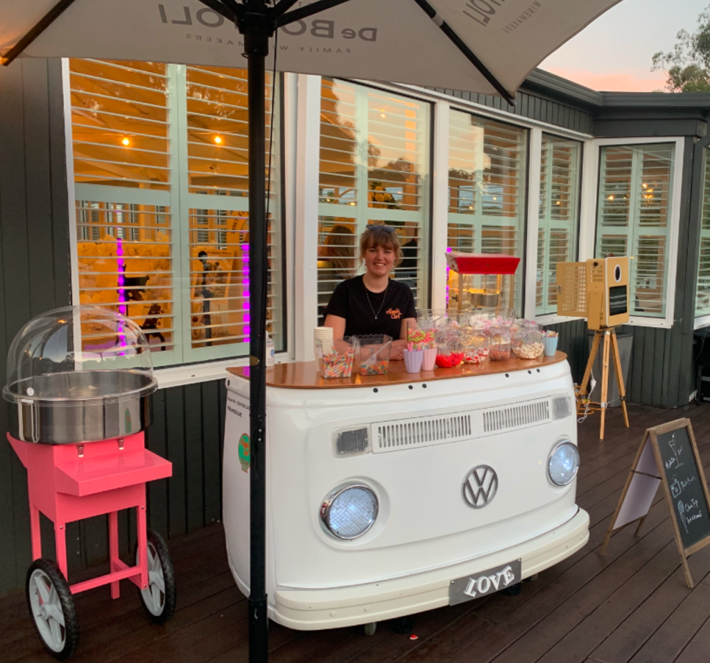 dessert cart with pick and mix lollies, fairy floss, cotton candy and popcorn for wedding venue